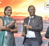 Owek. J.W. Katende honored with an award in recognition of The Ebonies' 47-year achievements